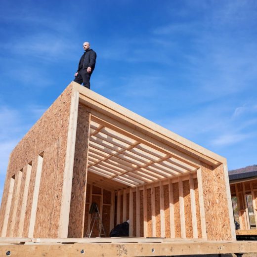 man-inspecting-quality-of-building-wooden-frame-ho-2022-08-19-07-12-06-utc