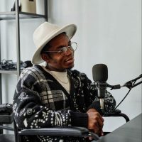 man-in-wheelchair-recording-podcast-2021-12-09-20-02-58-utc