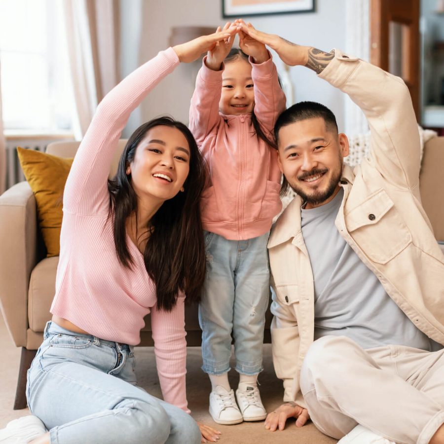 asian-family-with-child-celebrating-homeownership-2023-05-12-21-05-26-utc