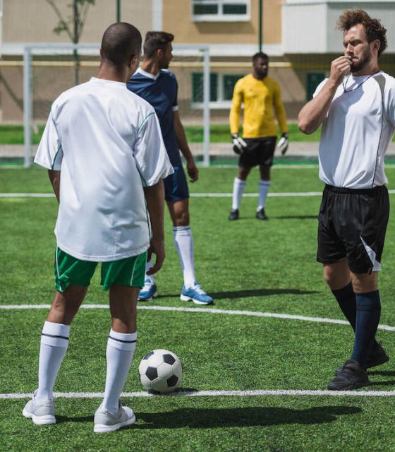 group-of-soccer-players-during-soccer-match-on-pit-2022-04-21-08-17-47-utc