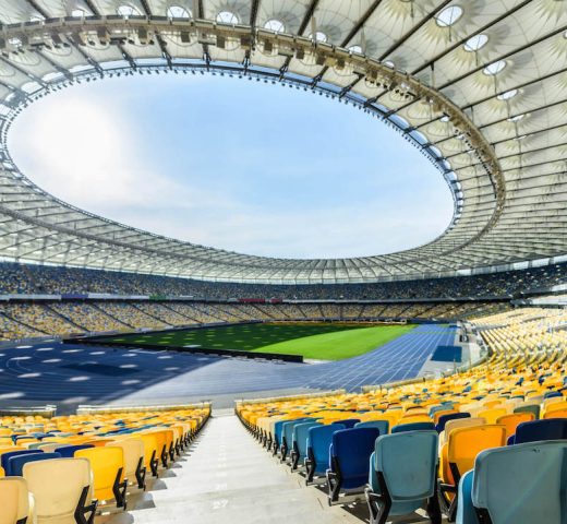 rows-of-yellow-and-blue-stadium-seats-on-soccer-fi-2021-08-29-10-48-54-utc