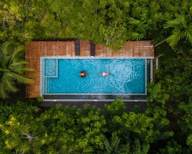aerial-view-of-swimming-pool-in-the-jungle-of-krab-2022-07-01-03-53-25-utc