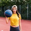 happy-young-woman-playing-basketball-2022-03-08-01-33-58-utc
