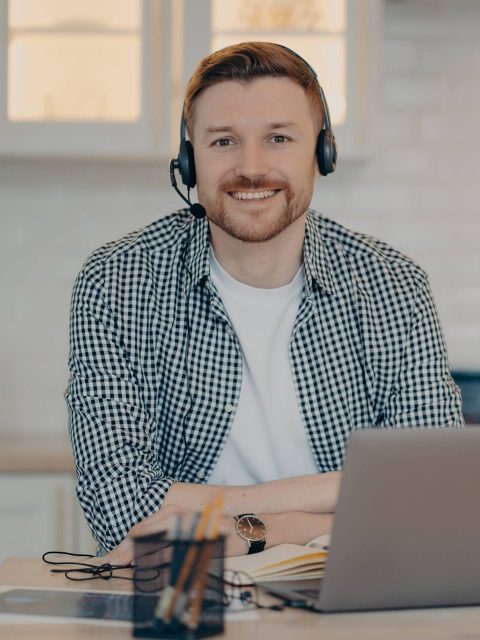 handsome-glad-man-customer-support-manager-gives-a-2022-01-27-18-15-48-utc