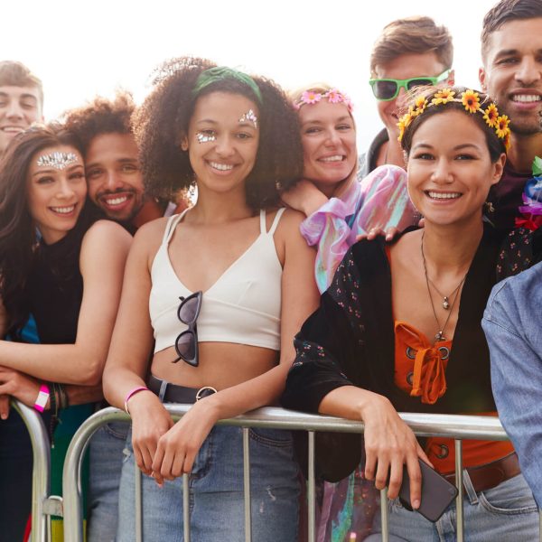portrait-of-young-friends-in-audience-behind-barri-2023-11-27-04-49-25-utc