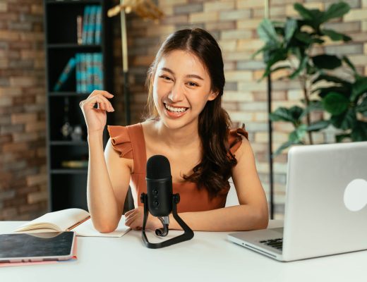 cheerful-blogger-using-mic-for-podcast-2021-09-04-03-50-49-utc